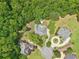 Aerial view of the property with lush trees surrounding at 3235 Munsey Ct, Cumming, GA 30041