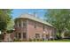A beautiful brick home with a lush backyard and mature trees at 3235 Munsey Ct, Cumming, GA 30041