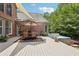 Backyard deck featuring dining area and luxurious hot tub at 3235 Munsey Ct, Cumming, GA 30041