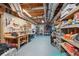 Unfinished basement with exposed ceiling and shelving for ample storage at 3235 Munsey Ct, Cumming, GA 30041