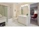 Bright bathroom with white cabinets, modern fixtures, and a combined tub and shower at 3235 Munsey Ct, Cumming, GA 30041