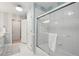 Stylish bathroom featuring a tub, glass sliding door, and modern fixtures for a clean look at 3235 Munsey Ct, Cumming, GA 30041