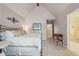 Bedroom featuring neutral walls, metal bed frame, and adjoining bathroom at 3235 Munsey Ct, Cumming, GA 30041