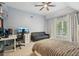 Cozy bedroom with neutral walls and a window that lets in lots of natural light at 3235 Munsey Ct, Cumming, GA 30041
