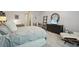 Stylized bedroom features a large bed, decor, and a seating area at 3235 Munsey Ct, Cumming, GA 30041