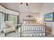 Inviting bedroom with a metal bed frame, stylish decor, and a bay window offering a serene ambiance at 3235 Munsey Ct, Cumming, GA 30041