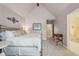 Cozy bedroom with metal bed frame, neutral carpeting and adjacent bathroom at 3235 Munsey Ct, Cumming, GA 30041