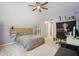 Comfortable bedroom featuring a ceiling fan, shelving, and desk at 3235 Munsey Ct, Cumming, GA 30041