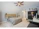 Comfortable bedroom with grey carpet, a wooden headboard, and functional shelving for storage at 3235 Munsey Ct, Cumming, GA 30041