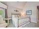 Charming bedroom with a metal bed frame, neutral walls, plush carpeting and decor at 3235 Munsey Ct, Cumming, GA 30041