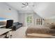 Relaxing bedroom space featuring a bed, ceiling fan, desk and a view to the outside at 3235 Munsey Ct, Cumming, GA 30041