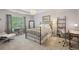 Comfortable bedroom boasts soft colors, ample natural light, and a stylish desk area at 3235 Munsey Ct, Cumming, GA 30041
