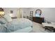 Bright bedroom featuring an iron bed frame, plush grey carpet, and a comfortable seating area at 3235 Munsey Ct, Cumming, GA 30041