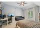 Well-lit bedroom features a work space, a couch, and grey carpet for a cozy feel at 3235 Munsey Ct, Cumming, GA 30041