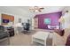 Spacious bedroom featuring a vaulted ceiling, ceiling fan, desk area and eating nook at 3235 Munsey Ct, Cumming, GA 30041