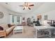 A bright bonus room with a ceiling fan, multiple windows, and flexible space for study or relaxation at 3235 Munsey Ct, Cumming, GA 30041