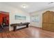 Bonus room with hardwood floors, natural light, and versatile space for recreation or relaxation at 3235 Munsey Ct, Cumming, GA 30041