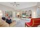 Comfortable bonus room with vaulted ceiling, fan, and shelving for storage and decor at 3235 Munsey Ct, Cumming, GA 30041