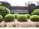 Community entrance features a brick sign and manicured bushes at 3235 Munsey Ct, Cumming, GA 30041