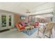 Relaxing covered patio with comfortable seating and a ceiling fan for pleasant outdoor living at 3235 Munsey Ct, Cumming, GA 30041