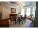 Elegant dining room featuring a chandelier, natural light, and a beautiful table at 3235 Munsey Ct, Cumming, GA 30041