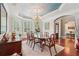 Dining room with hardwood floors, an elegant chandelier, and lots of natural light at 3235 Munsey Ct, Cumming, GA 30041