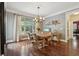 Bright and airy dining room with hardwood floors and natural light at 3235 Munsey Ct, Cumming, GA 30041