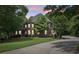 Beautiful brick home with mature trees and lush landscaping at 3235 Munsey Ct, Cumming, GA 30041