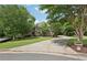 Beautiful brick home featuring a sprawling lawn and a paved driveway at 3235 Munsey Ct, Cumming, GA 30041
