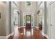 Grand foyer with hardwood floors, high ceilings, and arched doorways at 3235 Munsey Ct, Cumming, GA 30041