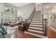 Grand foyer showcasing staircase, hardwood floors, and a welcoming entrance to the living area at 3235 Munsey Ct, Cumming, GA 30041