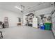 Clean, well-lit garage with epoxy flooring and ample storage space at 3235 Munsey Ct, Cumming, GA 30041