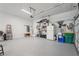 Well-organized garage with ample storage, epoxy flooring and convenient access to the home at 3235 Munsey Ct, Cumming, GA 30041