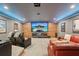 Spacious home theater featuring a large screen, comfortable seating, and custom lighting at 3235 Munsey Ct, Cumming, GA 30041