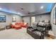 Large basement home theater with tiered seating, a wet bar, and an open floor plan at 3235 Munsey Ct, Cumming, GA 30041