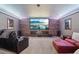 Spacious home theater featuring a large screen, comfortable seating, and custom lighting at 3235 Munsey Ct, Cumming, GA 30041