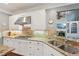 View of the kitchen featuring a gas stovetop, granite countertops and stainless steel sink at 3235 Munsey Ct, Cumming, GA 30041