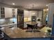 A modern kitchen featuring granite counters, stainless steel appliances, and a convenient wine rack for optimal storage at 3235 Munsey Ct, Cumming, GA 30041