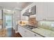 This open concept kitchen offers stainless steel appliances, granite countertops, and lots of counter space at 3235 Munsey Ct, Cumming, GA 30041