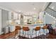 This bright kitchen offers lots of seating at the bar, stainless steel appliances, and gorgeous granite countertops at 3235 Munsey Ct, Cumming, GA 30041