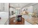 Open kitchen with granite countertops, stainless appliances, and a functional center island at 3235 Munsey Ct, Cumming, GA 30041