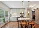 Updated kitchen with stainless appliances, white marble countertops, kitchen island, and a sliding barn door at 3235 Munsey Ct, Cumming, GA 30041