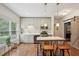 Updated kitchen featuring an island with seating, stainless steel appliances, and plenty of natural light at 3235 Munsey Ct, Cumming, GA 30041