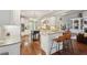 This spacious kitchen is equipped with an island, stainless steel appliances, and stunning granite countertops at 3235 Munsey Ct, Cumming, GA 30041