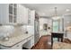 This bright kitchen features stainless steel appliances, granite countertops, and room to prepare meals at 3235 Munsey Ct, Cumming, GA 30041