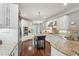 This expansive kitchen boasts stainless steel appliances, granite counters, and a center island at 3235 Munsey Ct, Cumming, GA 30041