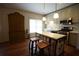This kitchen features a large island with seating, stainless steel appliances, and ample storage space at 3235 Munsey Ct, Cumming, GA 30041