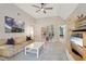 Comfortable living room with vaulted ceilings, media center, and neutral decor at 3235 Munsey Ct, Cumming, GA 30041