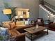 Cozy living room featuring a staircase, hardwood floors, and an open layout at 3235 Munsey Ct, Cumming, GA 30041