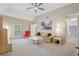 Bright living room with vaulted ceilings, neutral walls, plush carpeting and an abundance of natural light from nearby windows at 3235 Munsey Ct, Cumming, GA 30041